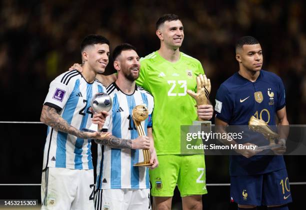 Lionel Messi of Argentina with the Golden Ball award, Enzo Fernandez with young player award, Emiliano Martinez with the Golden Glove award and...