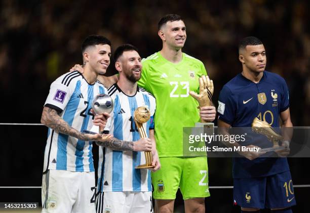 Lionel Messi of Argentina with the Golden Ball award, Enzo Fernandez with young player award, Emiliano Martinez with the Golden Glove award and...