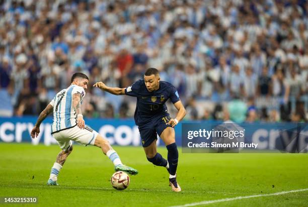 Kylian Mbappe of France and Rodrigo De Paul of Argentina during the FIFA World Cup Qatar 2022 Final match between Argentina and France at Lusail...