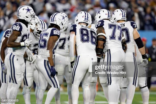 The Dallas Cowboys huddle against the Tennessee Titans during the first quarter of the game at Nissan Stadium on December 29, 2022 in Nashville,...