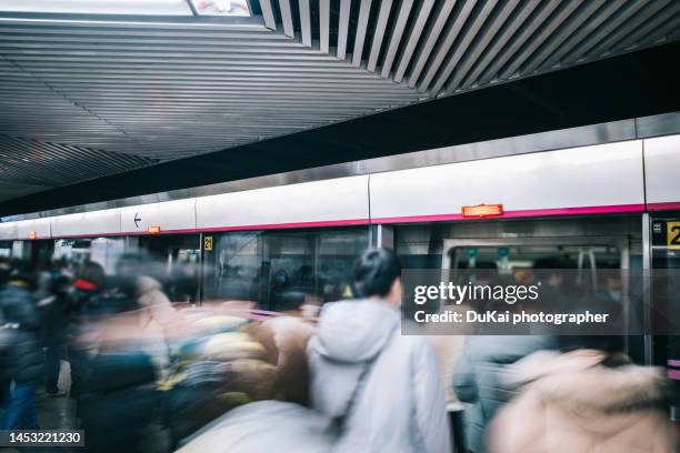 subway rush hour - disembarking train stock pictures, royalty-free photos & images