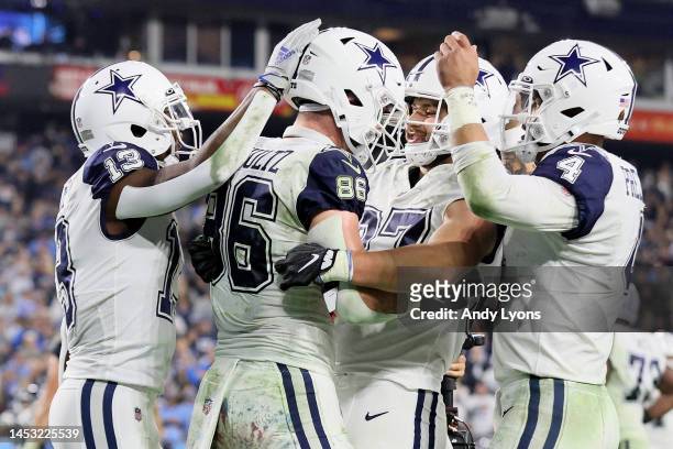 Dalton Schultz of the Dallas Cowboys celebrates with Michael Gallup, Jake Ferguson and Dak Prescott after scoring a six yard touchdown against the...