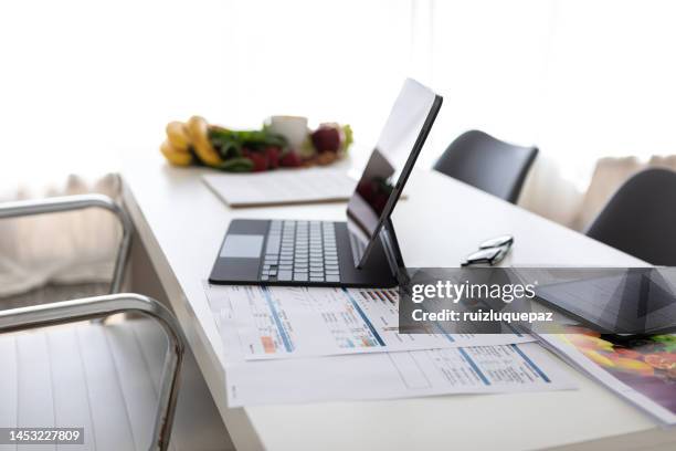 nutricionist desk at medical office showing nutritional plans, healthy food, desktop pc, digital tablet and body mass index measurement reports - ruler desk stock pictures, royalty-free photos & images