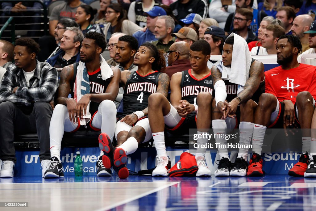Houston Rockets players react on the bench in the second half against ...