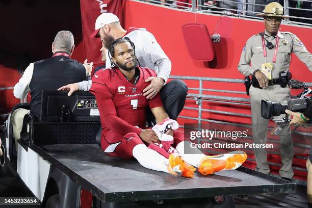 Quarterback Kyler Murray of the Arizona Cardinals is carted off the field after being injured against the New England Patriots during the first...