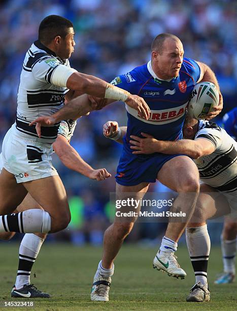 Rhys Lovegrove of Hull KR pulls away from Willie Manu of Hull during the Stobart Super League 'Magic Weekend' match between Hull Kingston Rovers and...