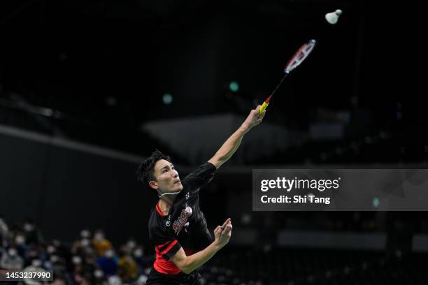 Kento Momota competes in the Men's Singles Final match against Kenta Nishimoto on day five of the 76th All Japan Badminton Championships at Musashino...