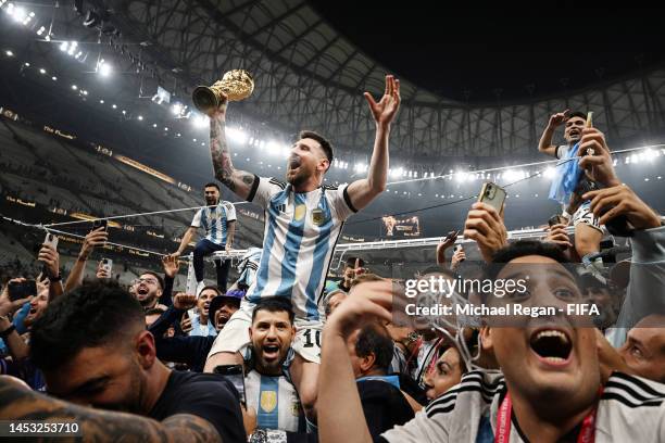 Lionel Messi celebrates with fans and team mates after winning the FIFA World Cup Qatar 2022 Final match between Argentina and France at Lusail...