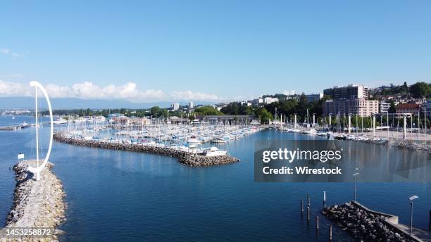 Scenic view of boats moored at the Port d'Ouchy on a sunny day in Lausanne, Switzerland