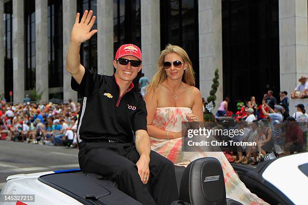 Ryan Briscoe of Australia driver of the Team Penske Dallara Chevrolet and his wife Nicole Briscoe wave to fans during the Indianapolis 500 Festival...