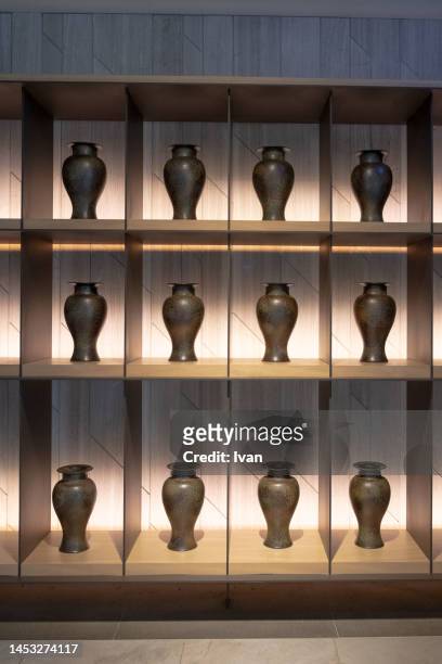 row of handmade vase on shelf - sugar bowl crockery stock pictures, royalty-free photos & images