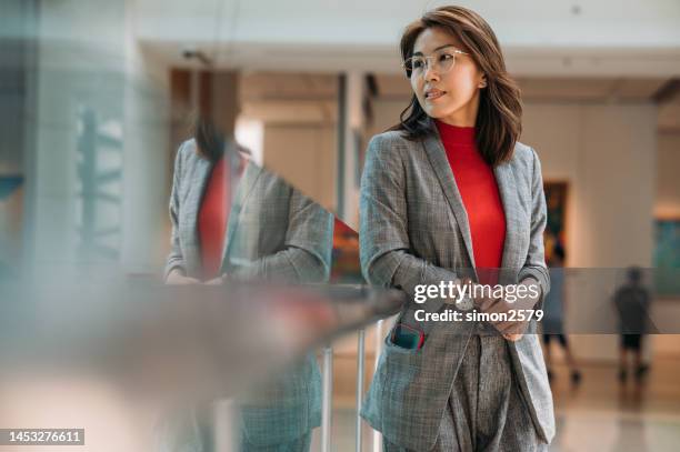 inner strength shines the way to future success - red blazer stock pictures, royalty-free photos & images