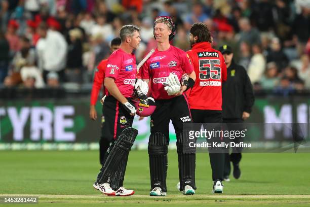 Dan Christian of the Sixers and Jordan Silk of the Sixers celebrate the win during the Men's Big Bash League match between the Melbourne Renegades...
