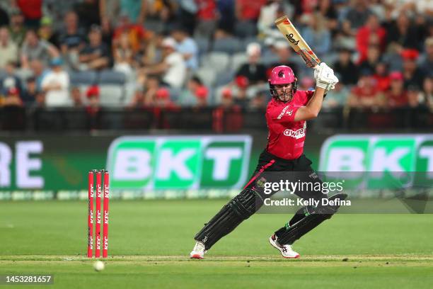 Dan Christian of the Sixers hits the winning ball during the Men's Big Bash League match between the Melbourne Renegades and the Sydney Sixers at...