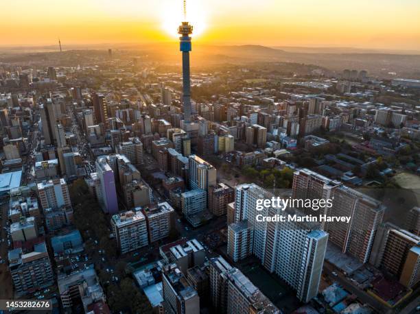 aerial view of the magnificent johannesburg city centre at sunset surrounded by smog and pollution - gauteng province stock pictures, royalty-free photos & images