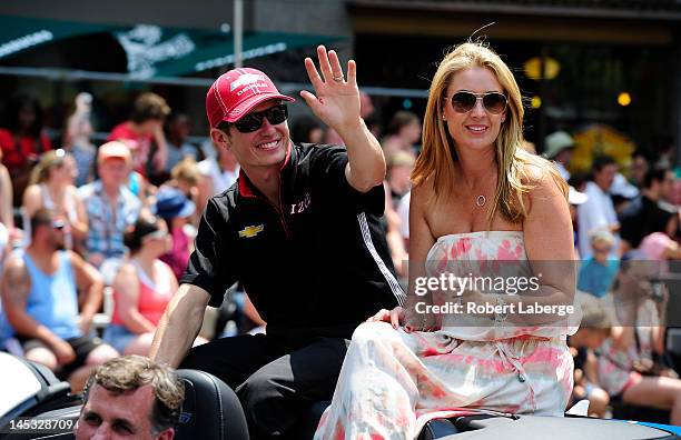 Ryan Briscoe of Australia driver of the Team Penske Dallara Chevrolet and his wife Nicole during the Indianapolis 500 Festival Parade part of the...