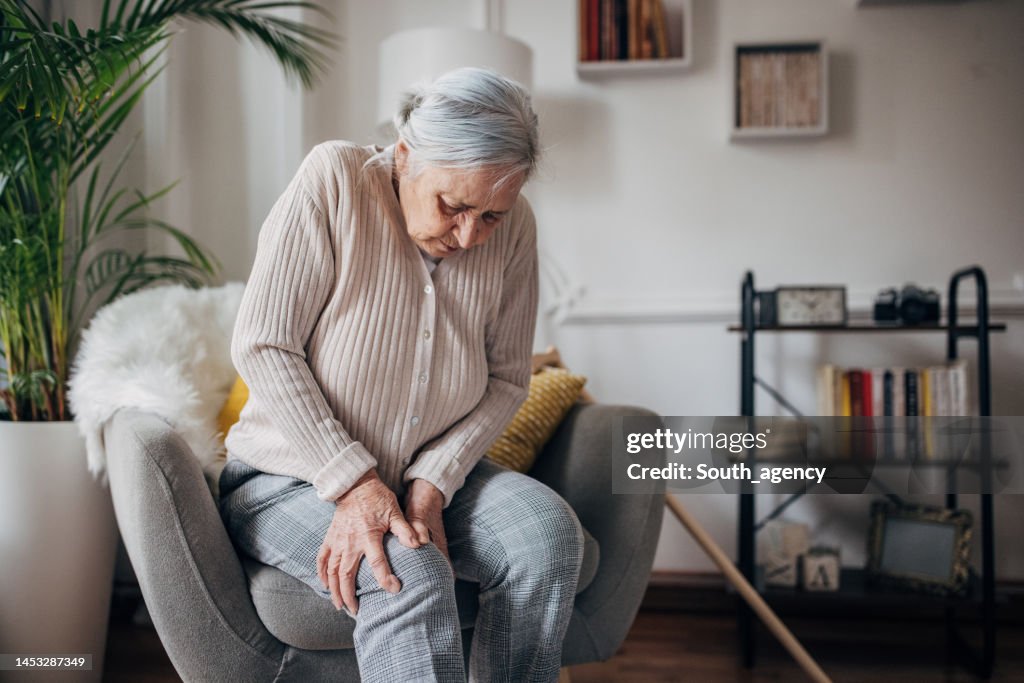 Old woman has knee pain