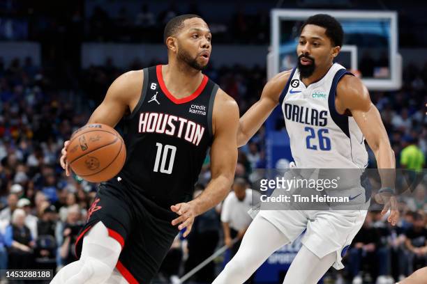 Eric Gordon of the Houston Rockets drives to the basket against Spencer Dinwiddie of the Dallas Mavericks in the first half at American Airlines...