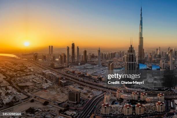 dubai downtown at sunrise - dubai skyline morning stock pictures, royalty-free photos & images