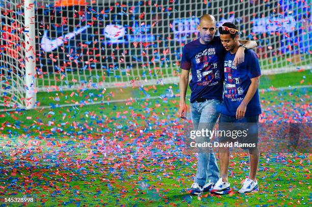 Head coach Josep Guardiola of FC Barcelona chats with Thiago Alcantara of FC Barcelona during the FC Barcelona celebrations following the club's...