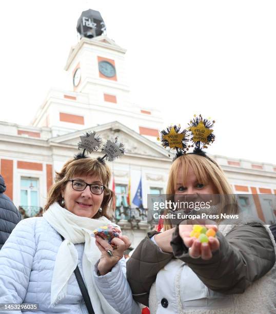 Two women show what they are going to eat during the Preuvas at Puerta del Sol on December 30 in Madrid, Spain. The Preuvas is a rehearsal for the 12...