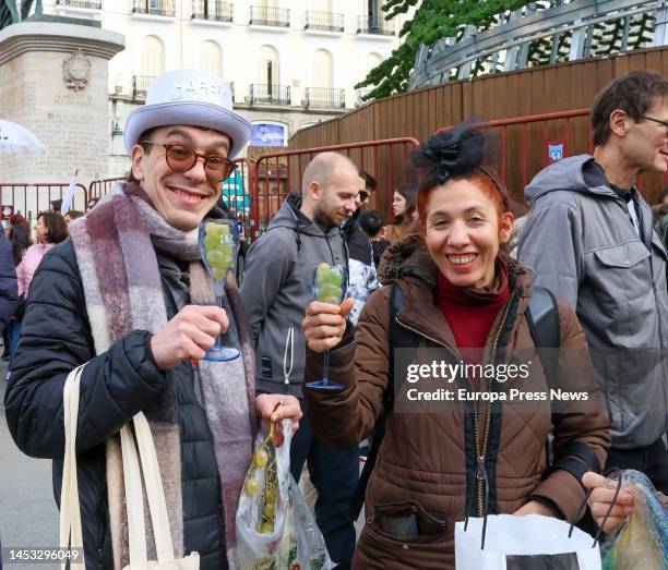 Two people show their grapes during the Preuvas at Puerta del Sol, on 30 December, 2022 in Madrid, Spain. The Preuvas is a rehearsal for the 12 New...