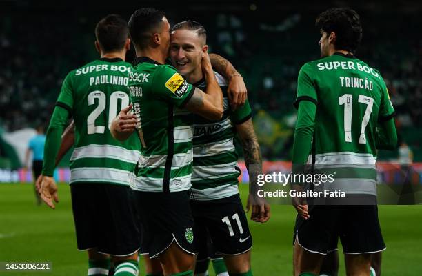 Pedro Porro of Sporting CP celebrates with teammate Nuno Santos of Sporting CP after scoring a goal during the Liga Bwin match between Sporting CP...