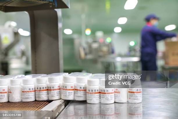 An employee works on the production line of ibuprofen, a fever reduction medicine, at a factory of Huazhong Pharmaceutical Co., Ltd on December 30,...
