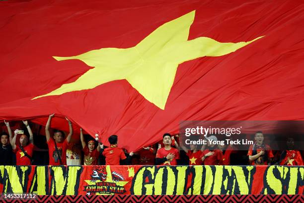 Vietnam fans sing the national anthem prior to the AFF Mitsubishi Electric Cup Group B match against Singapore at Jalan Besar Stadium on December 30,...
