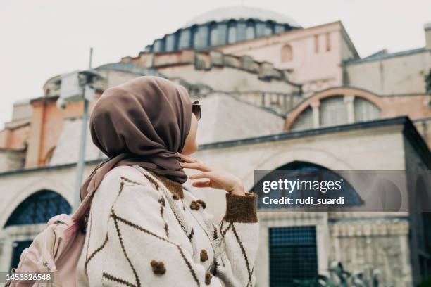 woman posing in front of hagia sophia - modest clothing stock pictures, royalty-free photos & images
