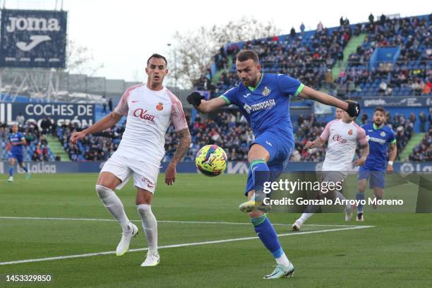 Borja Mayoral of Getafe CF competes for the ball with Franco Russo of RCD Mallorca during the LaLiga Santander match between Getafe CF and RCD...
