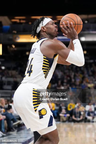 Buddy Hield of the Indiana Pacers attempts a shot in the in the third quarter against the Cleveland Cavaliers at Gainbridge Fieldhouse on December...