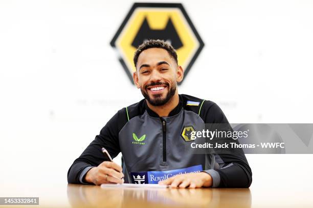 Matheus Cunha signs his contract for Wolverhampton Wanderers at The Sir Jack Hayward Training Ground on December 22, 2022 in Wolverhampton, England.