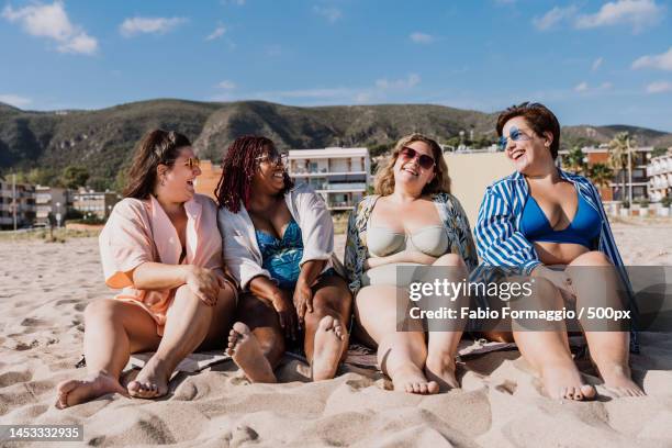 group of plus size women with swimwear at the beach,barcelona,spain - barcelona tours stock pictures, royalty-free photos & images