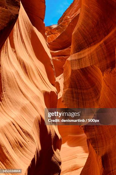 low angle view of rock formation - gesteinsart stock-fotos und bilder