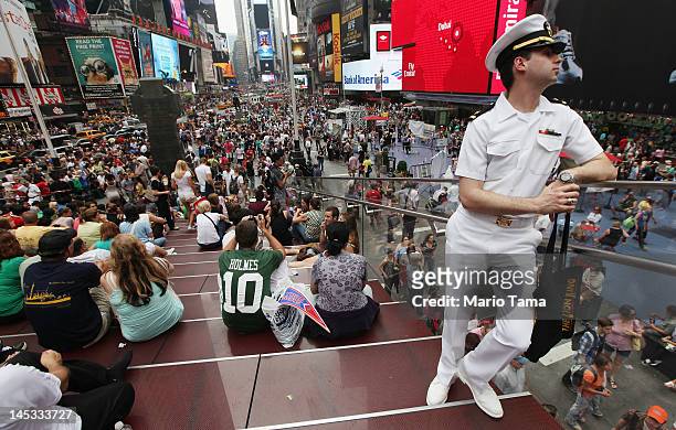 Navy Ensign Christopher Welty stands in Times Square during Fleet Week festivities on May 26, 2012 in New York City. Fleet week, which has been held...