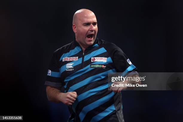 Rob Cross of England celebrates winning the first set during his Fourth Round match against Chris Dobey of England during Day Eleven of The Cazoo...
