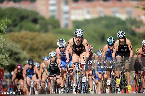 In this photo provided by the International Triathlon Union, Svenja Bazlen of Germany leads the women up the hill at the 2012 ITU World Triathlon en...
