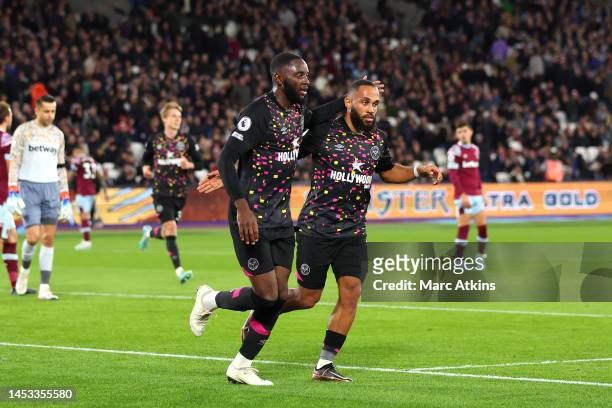 Josh Dasilva of Brentford celebrates with teammate Bryan Mbeumo after scoring their side's second goal during the Premier League match between West...