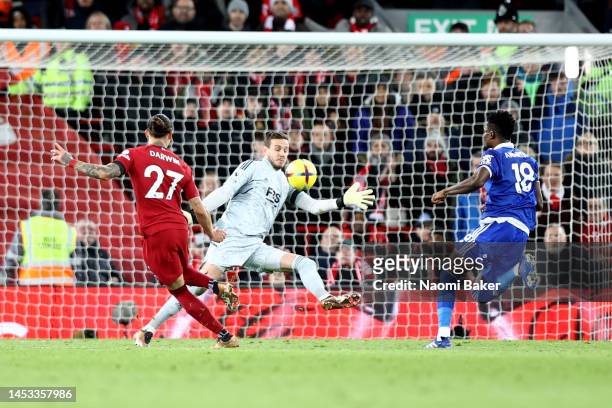 Darwin Nunez of Liverpool sees his shot go past Danny Ward of Leicester City and hit the post as Wout Faes of Leicester City meets the off the post...