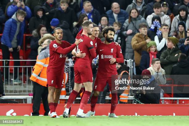 Darwin Nunez of Liverpool celebrates with teammates their side's second goal which saw his shot go past Danny Ward of Leicester City and hit the post...