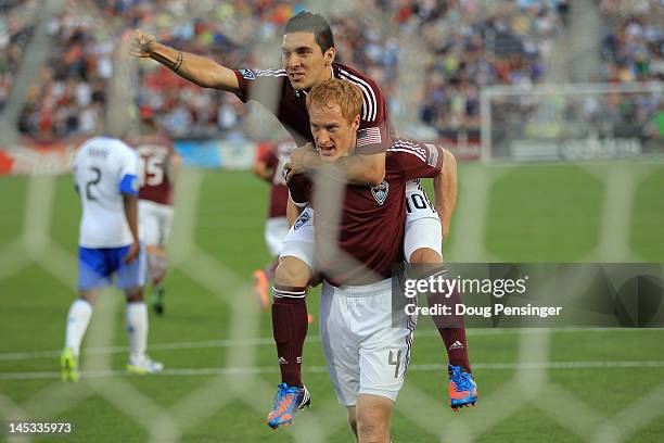 Jeff Larentowicz of the Colorado Rapids celebrates his goal on a penalty shot with Martin Rivero of the Colorado Rapids in the 18th minute to tie the...