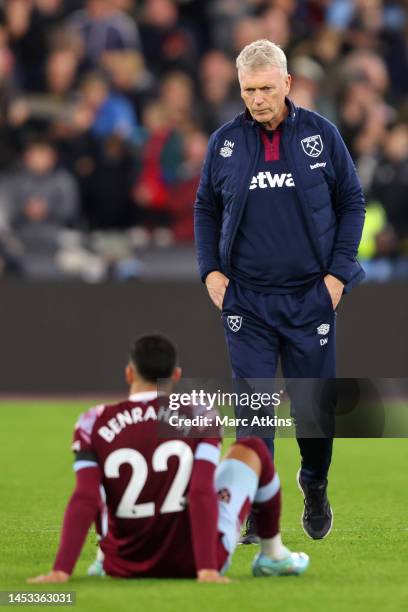 David Moyes, Manager of West Ham United walks over to Said Benrahma of West Ham United following defeat in the Premier League match between West Ham...