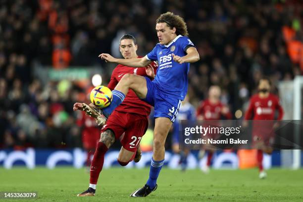 Wout Faes of Leicester City is challenged by Darwin Nunez of Liverpool during the Premier League match between Liverpool FC and Leicester City at...