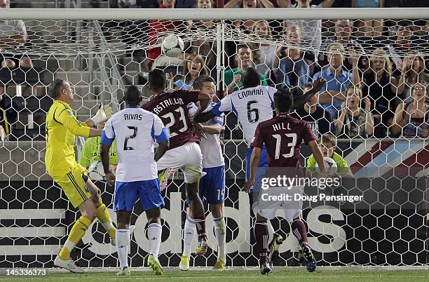 Jaime Castrillon of the Colorado Rapids heads the ball past Jeb Brovsky, Hassoun Camara and goalkeeper Greg Sutton of the Montreal Impact for the...