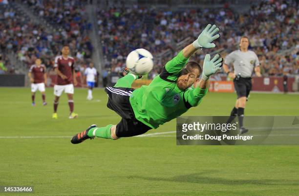 Goalkeeper Matt Pickens of the Colorado Rapids dives to make a save against the Montreal Impact at Dick's Sporting Goods Park on May 26, 2012 in...