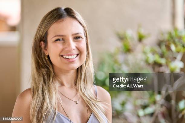 young female architect standing in her office and smiling - toothy smile stock pictures, royalty-free photos & images