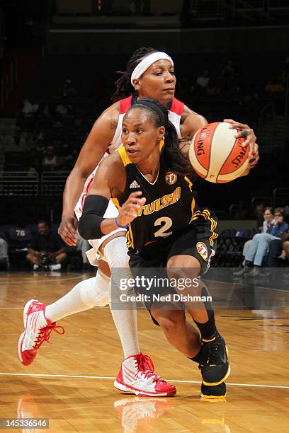 Temeka Johnson of the Tulsa Shock drives against Dominique Canty of the Washington Mystics at the Verizon Center on May 26, 2012 in Washington, DC....
