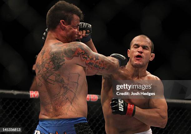 Junior dos Santos punches Frank Mir during the Heavyweight Championship bout at UFC 146 at MGM Grand Garden Arena on May 26, 2012 in Las Vegas,...