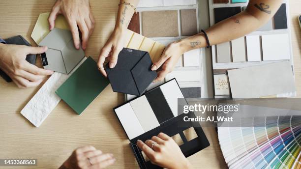 interior designer and clients discussing tile and color options during a meeting - amostra de cor imagens e fotografias de stock